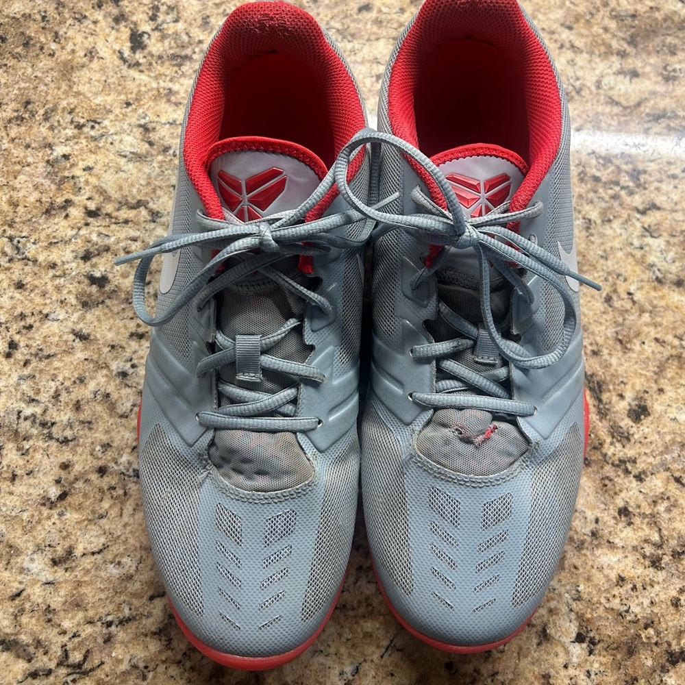 12 Nike Kobe basketball shoes in a sleek gray and neon orange colorway